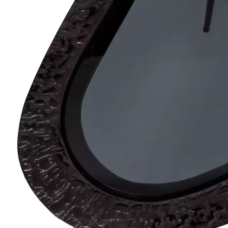 Tavolino ovale con base in alluminio e piano in vetro