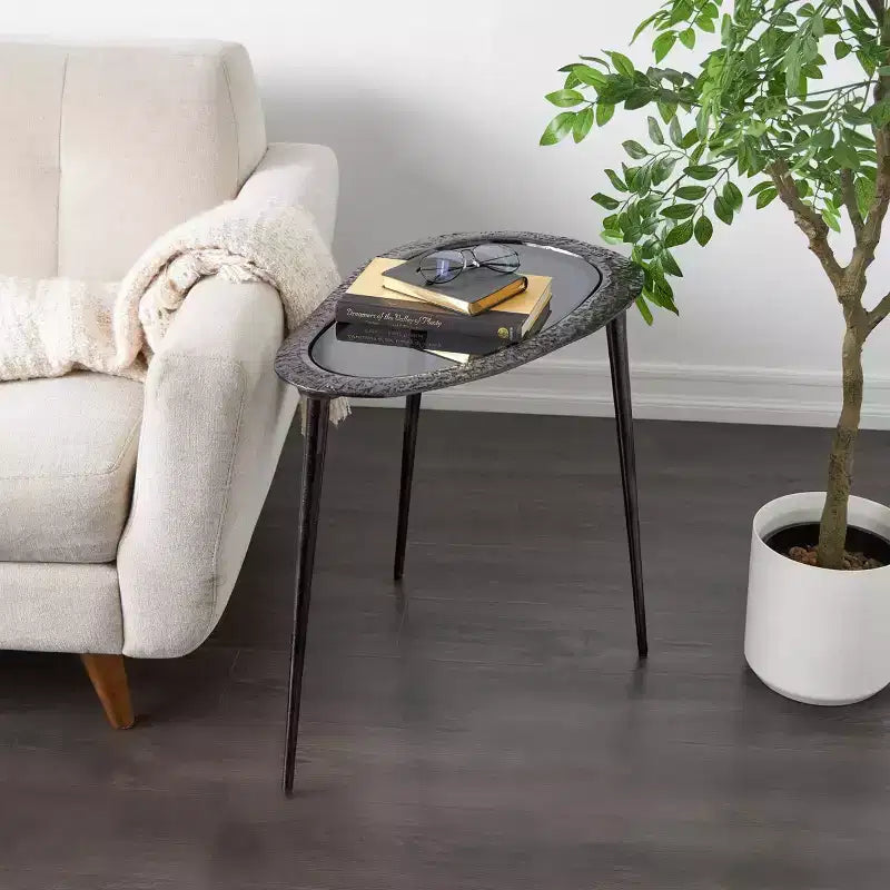 Tavolino ovale con base in alluminio e piano in vetro